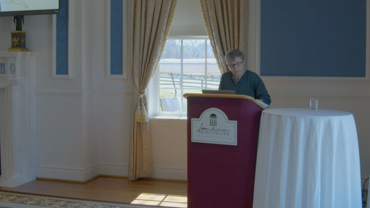 Angela Kreider standing at a lectern