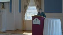 Angela Kreider standing at a lectern
